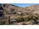 Aerial view of homes nestled in a mountainside community at 211 E Desert Wind Dr, Phoenix, AZ 85048