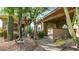 Landscaped backyard with desert plants and a built-in grill at 211 E Desert Wind Dr, Phoenix, AZ 85048