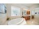 Bathroom with soaking tub and double vanity at 211 E Desert Wind Dr, Phoenix, AZ 85048