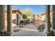 A paved courtyard with a fountain is surrounded by stone walls and landscaping at 211 E Desert Wind Dr, Phoenix, AZ 85048