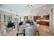 Open concept dining area with kitchen views and modern lighting at 211 E Desert Wind Dr, Phoenix, AZ 85048