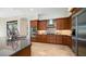 Modern kitchen features stainless steel appliances and granite counters at 211 E Desert Wind Dr, Phoenix, AZ 85048