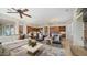 Bright living room with stone fireplace and large windows at 211 E Desert Wind Dr, Phoenix, AZ 85048