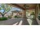 Covered patio with access to the main bedroom and backyard at 211 E Desert Wind Dr, Phoenix, AZ 85048