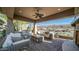 Outdoor patio area with wicker furniture and ceiling fan at 211 E Desert Wind Dr, Phoenix, AZ 85048