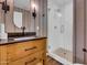 Stylish bathroom with a walk-in shower and wood vanity at 2130 E San Juan Ave, Phoenix, AZ 85016