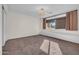 Bright bedroom with plush carpet, window seat, and stylish light fixture at 2130 E San Juan Ave, Phoenix, AZ 85016