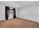 Spacious bedroom with neutral carpeting and ceiling fan at 2130 E San Juan Ave, Phoenix, AZ 85016