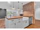 Farmhouse kitchen with a large island and butcher block top at 2130 E San Juan Ave, Phoenix, AZ 85016