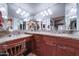 Double vanity bathroom with granite countertops and large mirrors at 2131 W Ironwood Dr, Chandler, AZ 85224