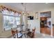 Casual dining area with glass table and chairs, offering a view of the backyard at 2131 W Ironwood Dr, Chandler, AZ 85224