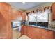 Well-equipped kitchen with light wood cabinetry and a corner sink at 2131 W Ironwood Dr, Chandler, AZ 85224