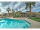 Inviting backyard oasis with sparkling pool, patio, and lush landscaping at 2131 W Ironwood Dr, Chandler, AZ 85224