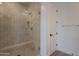 Walk in shower with glass enclosure and modern tile at 21411 W Meadowbrook Ave, Buckeye, AZ 85396