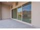 Covered back patio with sliding glass doors leading to backyard at 21418 W Meadowbrook Ave, Buckeye, AZ 85396