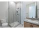 Bathroom with walk-in shower and gray tile at 21418 W Meadowbrook Ave, Buckeye, AZ 85396