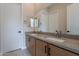 Modern bathroom with double sinks and gray countertops at 21418 W Meadowbrook Ave, Buckeye, AZ 85396