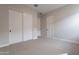 Spacious bedroom with double closets and neutral decor at 21418 W Meadowbrook Ave, Buckeye, AZ 85396