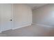 Simple bedroom with neutral walls and carpet at 21418 W Meadowbrook Ave, Buckeye, AZ 85396