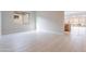 Bright dining room with tile flooring and view into kitchen at 21418 W Meadowbrook Ave, Buckeye, AZ 85396