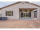 Back of house with covered patio and AC units at 21418 W Meadowbrook Ave, Buckeye, AZ 85396