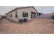 Back of house with large backyard and AC units at 21418 W Meadowbrook Ave, Buckeye, AZ 85396