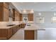 Modern kitchen with island and stainless steel appliances at 21418 W Meadowbrook Ave, Buckeye, AZ 85396