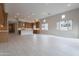 Open concept kitchen with wood cabinets and large island at 21418 W Meadowbrook Ave, Buckeye, AZ 85396