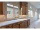 Kitchen features white quartz countertops and light wood cabinets at 21418 W Meadowbrook Ave, Buckeye, AZ 85396