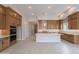 Bright kitchen with center island and ample cabinetry at 21418 W Meadowbrook Ave, Buckeye, AZ 85396