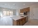 Open kitchen concept with island, stainless steel appliances, and view to Gathering room at 21418 W Meadowbrook Ave, Buckeye, AZ 85396