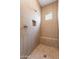 Modern walk-in shower with wood-look tile and built-in seat at 21418 W Meadowbrook Ave, Buckeye, AZ 85396