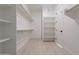 Large walk-in closet with ample shelving and hanging space at 21418 W Meadowbrook Ave, Buckeye, AZ 85396