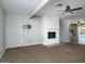 Bright living room with fireplace and neutral carpeting at 2215 E Des Moines Cir, Mesa, AZ 85213