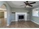 Living room with fireplace and wood-look flooring at 2215 E Des Moines Cir, Mesa, AZ 85213