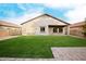 Artificial turf backyard with patio and home exterior view at 2304 S Abbey --, Mesa, AZ 85209