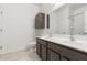 Main bathroom with double vanity, large mirror, and ample storage at 2304 S Abbey --, Mesa, AZ 85209