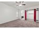 Bedroom with barn door leading to closet and bathroom access at 2304 S Abbey --, Mesa, AZ 85209