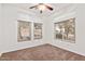 Well-lit bedroom featuring two windows and carpet at 2304 S Abbey --, Mesa, AZ 85209