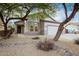 One-story house with a two-car garage and desert landscaping at 2304 S Abbey --, Mesa, AZ 85209