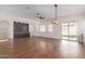 Dining room with hardwood floors, sliding glass doors, and built-in cabinetry at 2410 W Aloe Vera Dr, Phoenix, AZ 85085