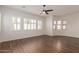 Bright and airy living room with wood floors and large windows at 2410 W Aloe Vera Dr, Phoenix, AZ 85085