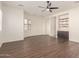 Main bedroom with hardwood floors, ceiling fan, and large windows with plantation shutters at 2410 W Aloe Vera Dr, Phoenix, AZ 85085