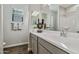 Modern bathroom with double vanity and shower at 24111 W Flores Dr, Buckeye, AZ 85326