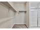 Neat and clean bathroom with a shower and built-in shelving at 24111 W Flores Dr, Buckeye, AZ 85326