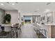 Open concept dining area with view of living room and kitchen at 24111 W Flores Dr, Buckeye, AZ 85326