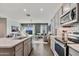 Modern kitchen with island and stainless steel appliances at 24111 W Flores Dr, Buckeye, AZ 85326