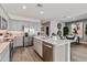 Modern kitchen with island, stainless steel appliances, and ample counter space at 24111 W Flores Dr, Buckeye, AZ 85326