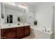 Bathroom with double vanity, soaking tub, and shower at 2528 W Brookhart Way, Phoenix, AZ 85085