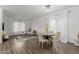 Light and airy dining room with hardwood floors and a charming table set at 2528 W Brookhart Way, Phoenix, AZ 85085